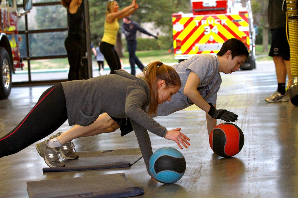 Students, staff, faculty, and visitors participating in Fit for Fire at the UC Davis Fire Department.