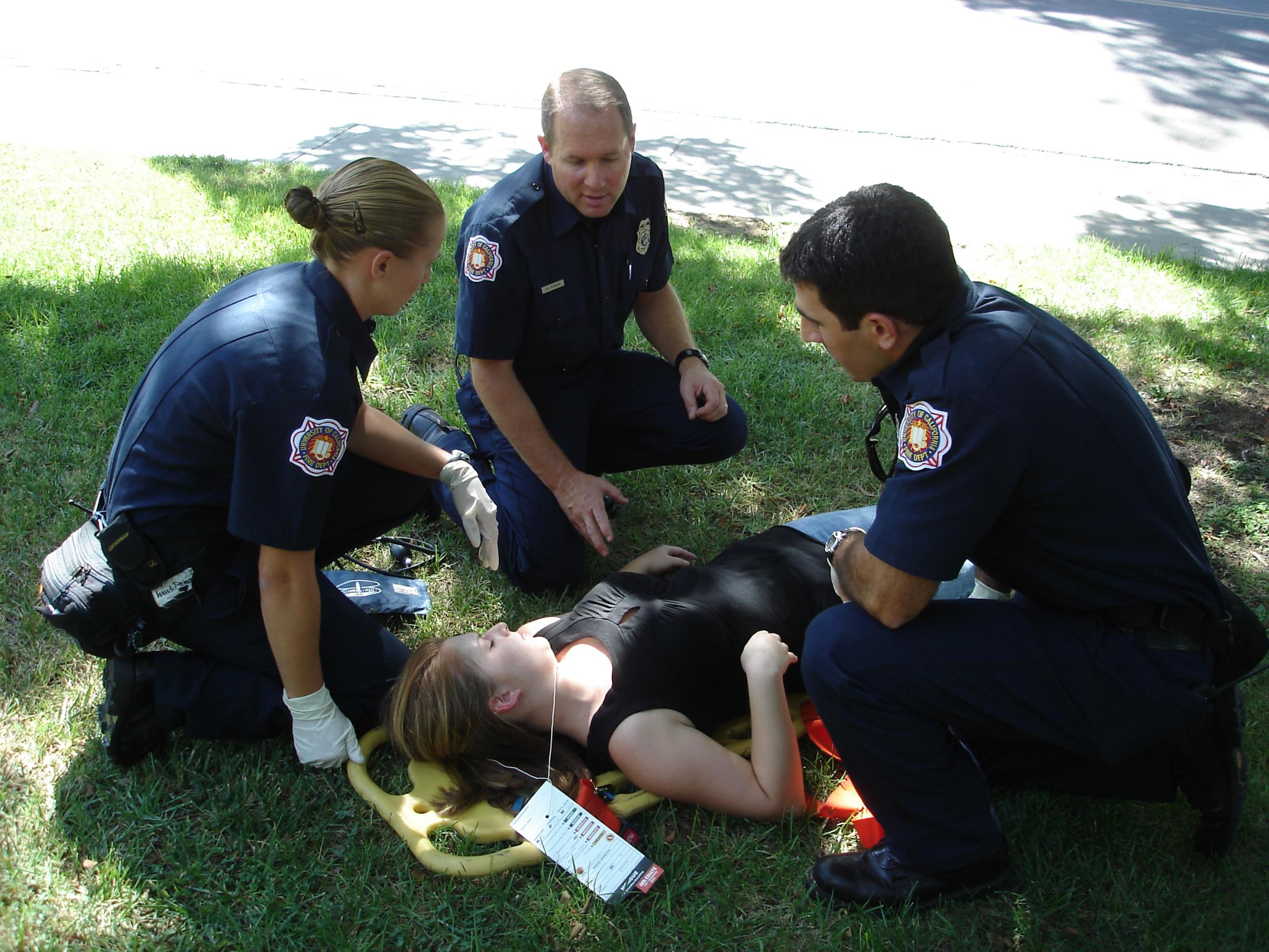 "UC Davis Firefighters giving medical care"