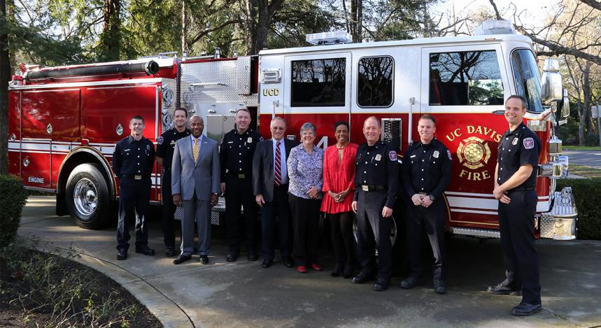 Eleven breakfast guests, including the new fire engine! From left: firefighter Kyle Dubs, Assistant Fire Chief Jeff Seaton, Chancellor Gary S. May, Fire Chief Nate Trauernicht, Provost and Executive Vice Chancellor Ralph J. Hexter, Vice Chancellor Kelly Ratliff, LeShelle May, Capt. Joe Newman, firefighter Ryan Tooley and Assistant Fire Chief Nathaniel Hartinger. (Grant Nejedlo/UC Davis)