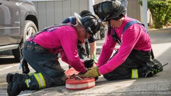 Firefighter wearing pink shirts