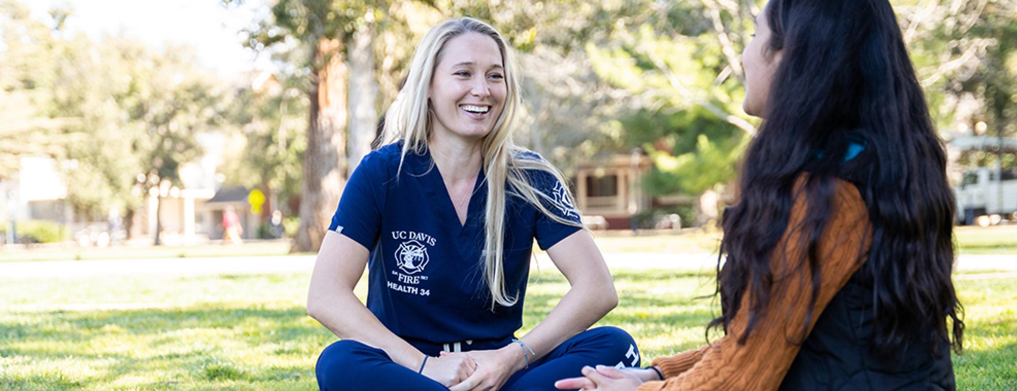 Health 34 employee sitting and talking with student