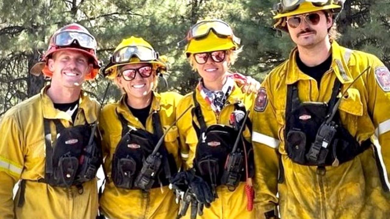 Four Firefighters dressed in special gear