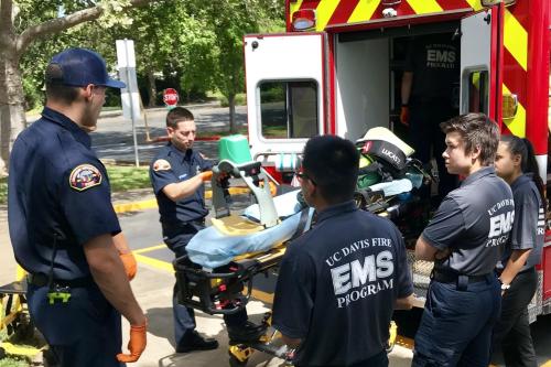 Students part of the EMS program listen as a demonstration takes place.