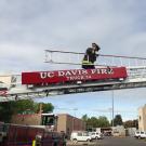 UC Davis Firefighter climbing aerial ladder