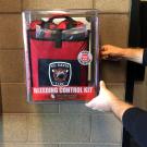 Red Stop the Bleed kit installed on the UC Davis Fire Department Wall.
