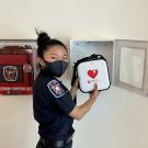 UC Davis Fire Student EMT checks campus AED cabinet