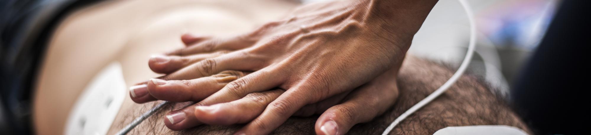 Person providing CPR.